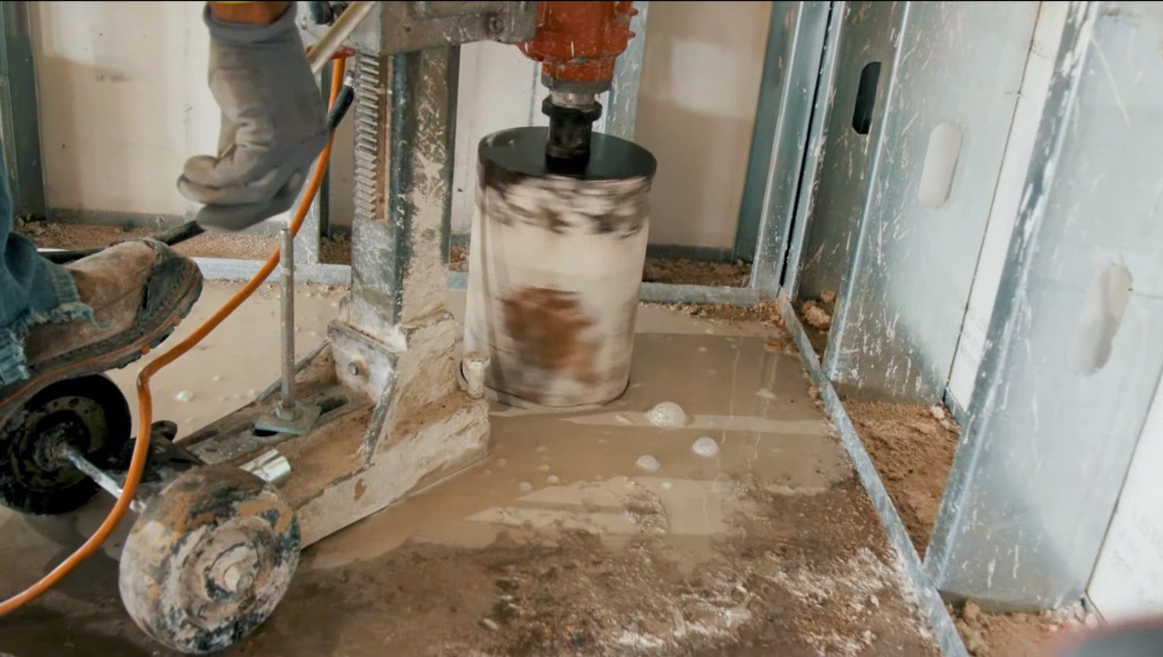 Core drilling through a concrete floor